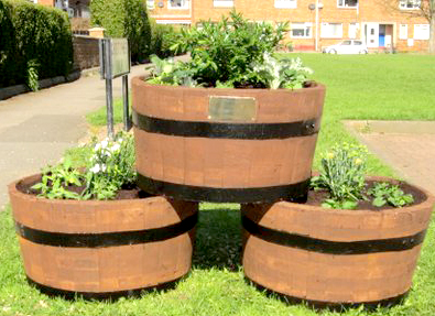 Residents Win Grant for Garden Tubs on Green